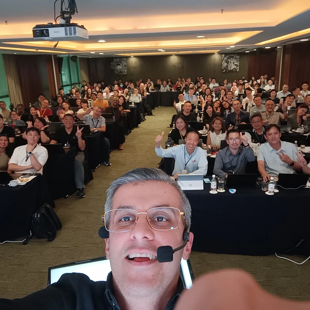 A full room of delegates at their laptops during an AI-First Mindset workshop